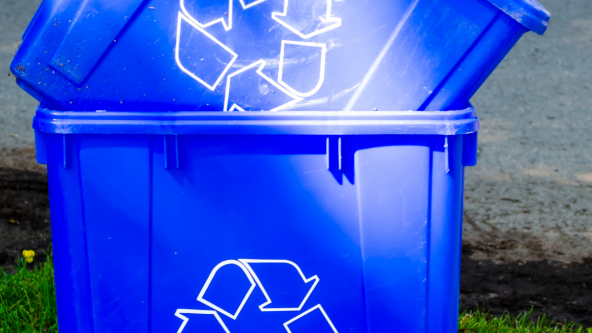 two blue box recycling bins stacked on top of one another