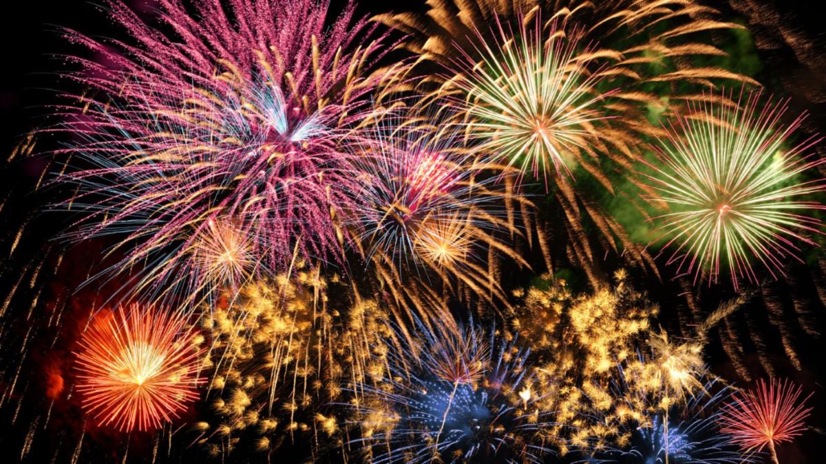 fireworks going off in the night sky