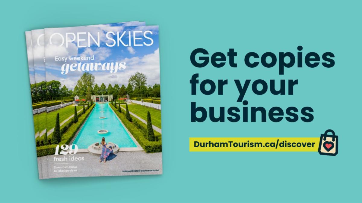 Copies of Open Skies magazine on a teal background with text: Get copies for your business. durhamtourism.ca/discover