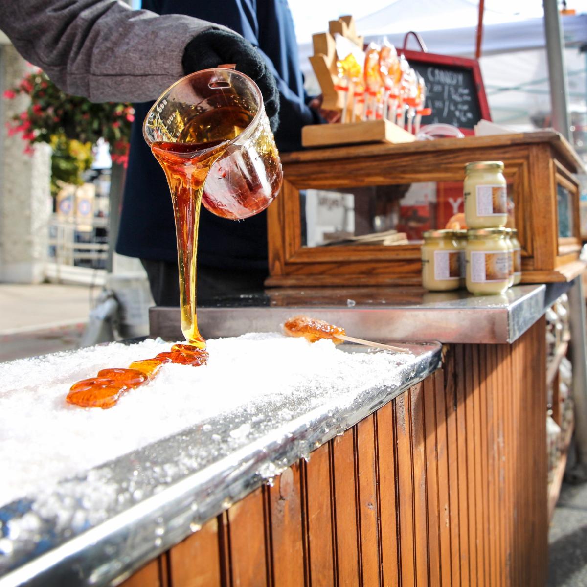 maple syrup being poured on snow