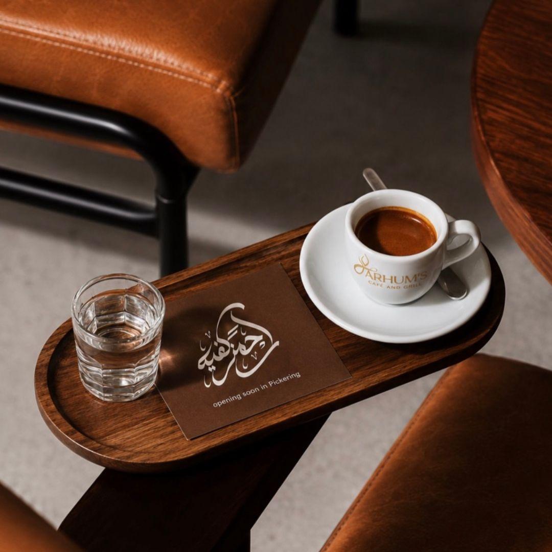 cup of coffee and glass of water laid out on a tray