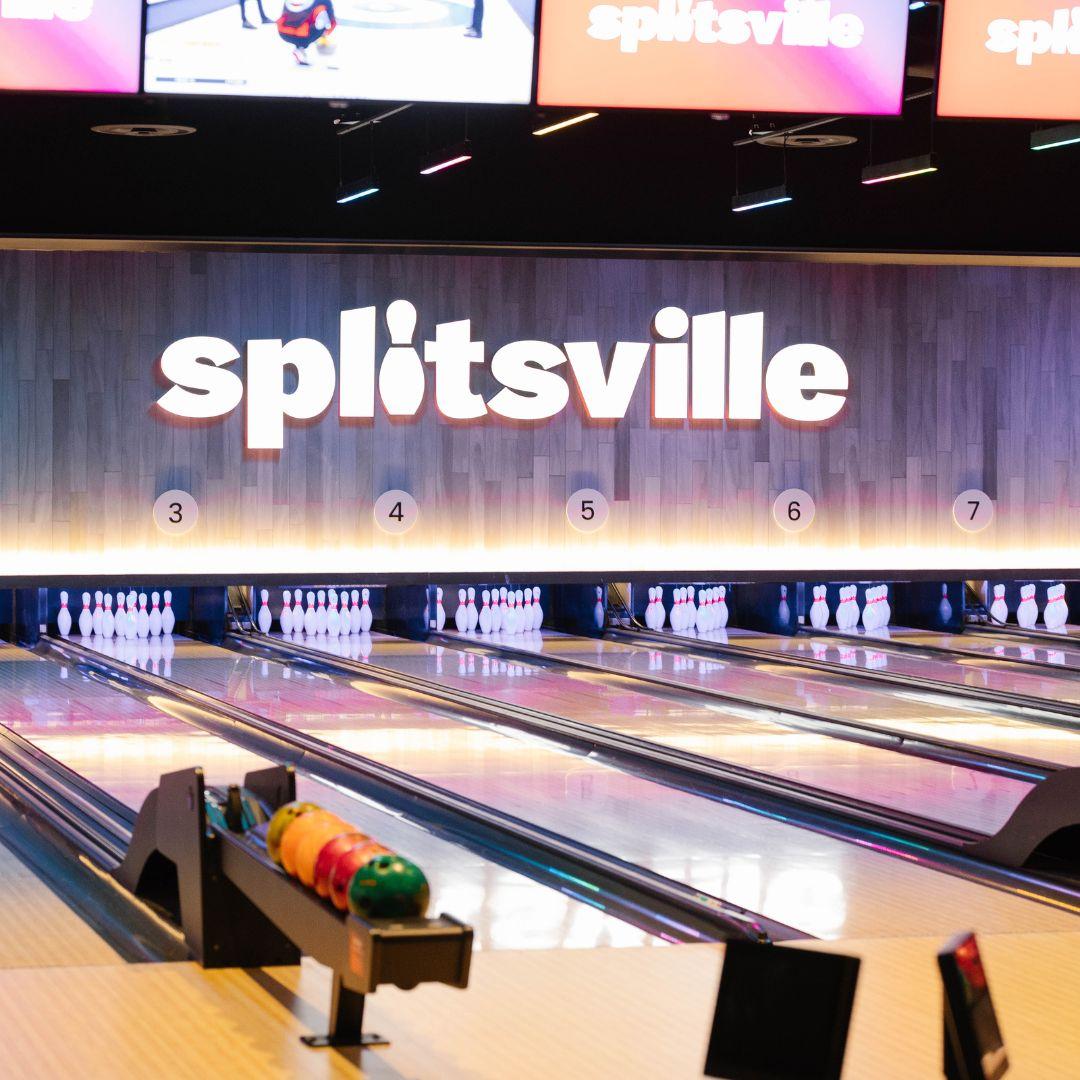 bowling lanes with Splitsville logo on the wall