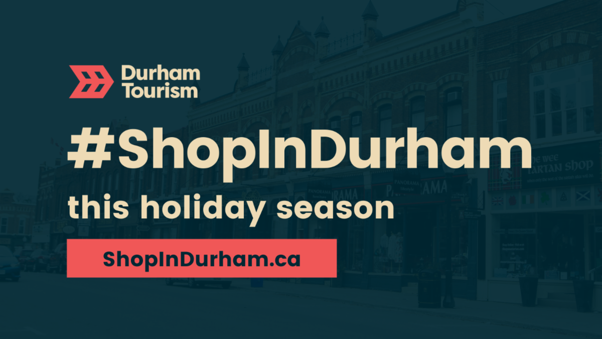 background image of downtown Port Perry with Durham Tourism logo, and text: #ShopInDurham this holiday season, shopindurham.ca