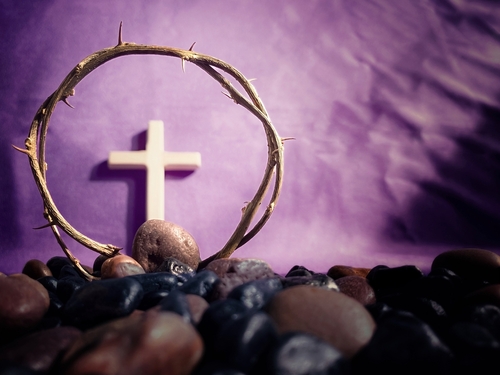 Lent Season_Holy Week and Good Friday Concepts. Crown of thorns in purple background. Stock photo.