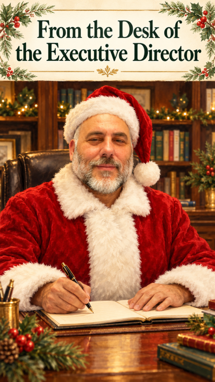 LIFTT Executive Director Carlos Ramalho dressed in a Santa Suit, sitting behind a desk with the text above reading "From the desk of the executive director"