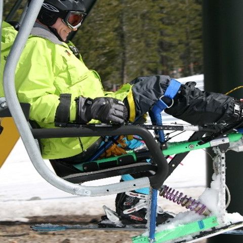 Peter Axelson in a monoski loading onto a chairlift.
