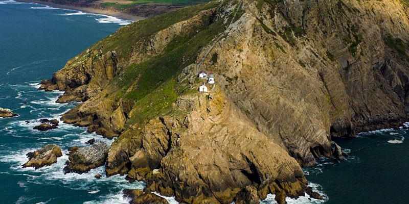 An aerial view of the point with the lighthouse
