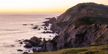 A rugged coastline at sunset