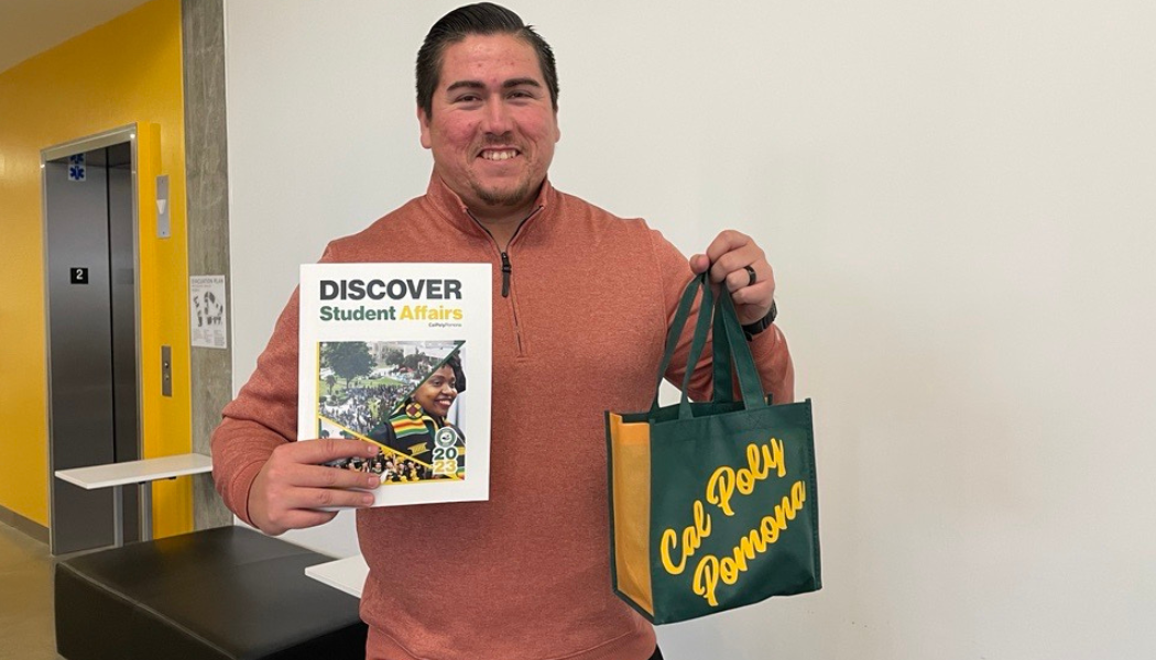 Reggie holding a bag of CPP swag