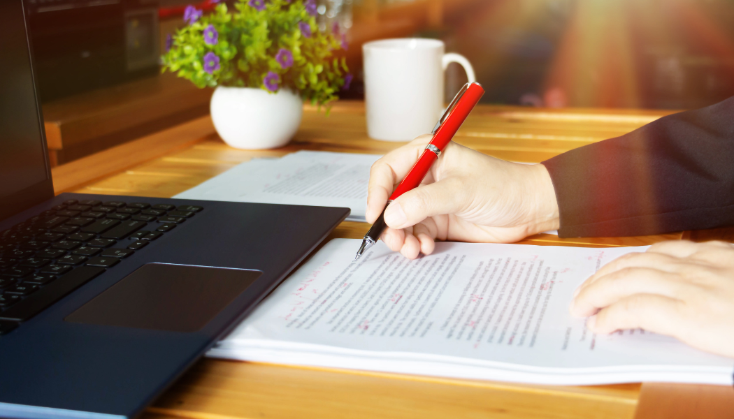 Proofreading a paper and marking edits with red pen