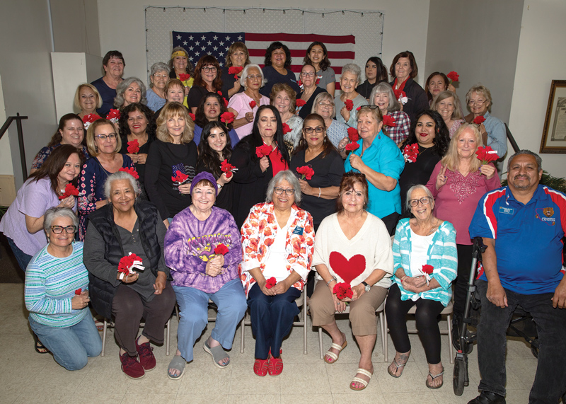 ALA members holding poppies