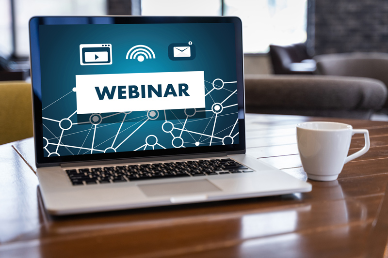 laptop computer with webinar showing