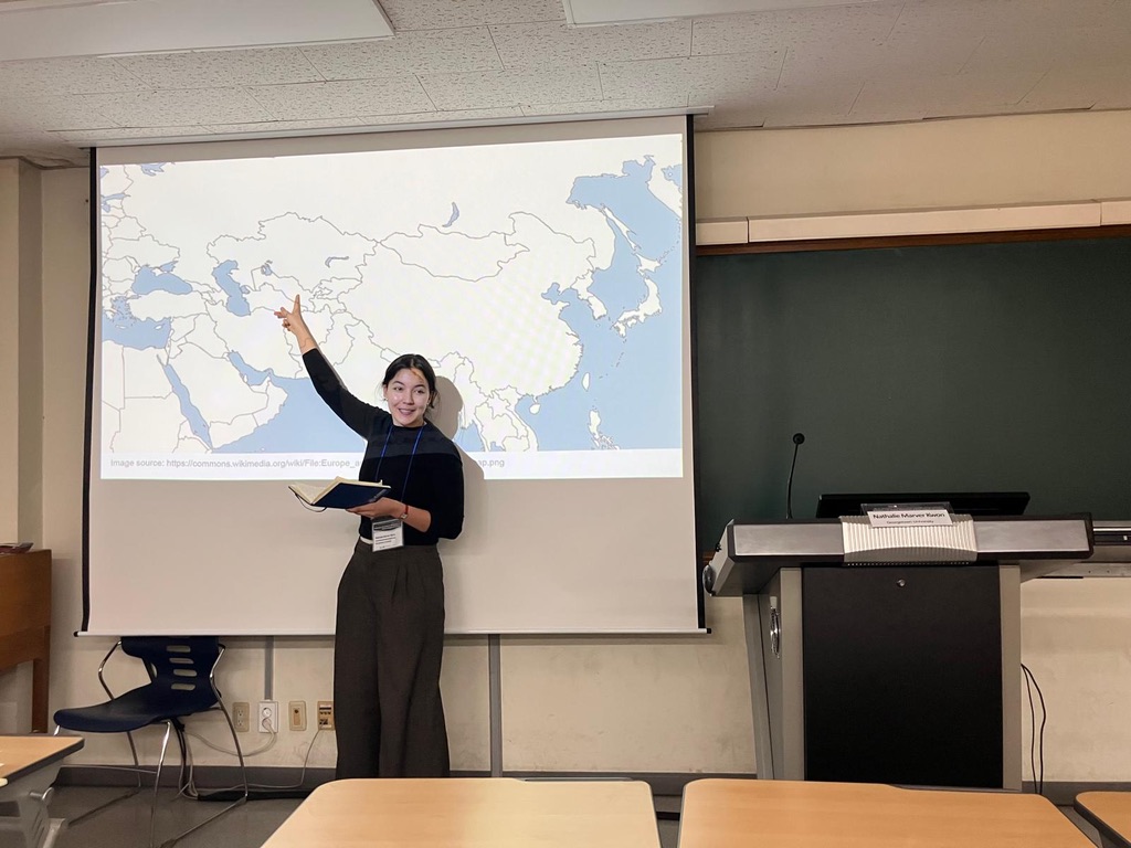 Nathalie Marver-Kwon presenting her research at Yonsei University conference, pointing to a map on the screen