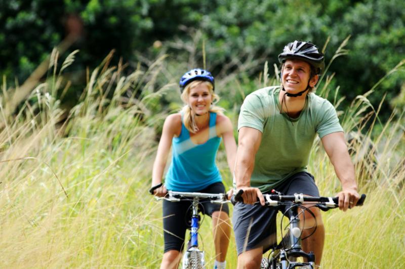 happy_couple_riding_bikes.jpg