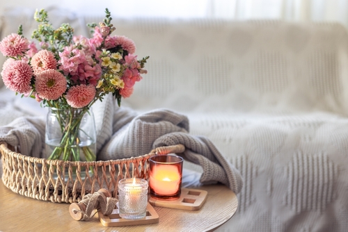 Cozy home interior with flowers dahlias. Autumn home comfort.