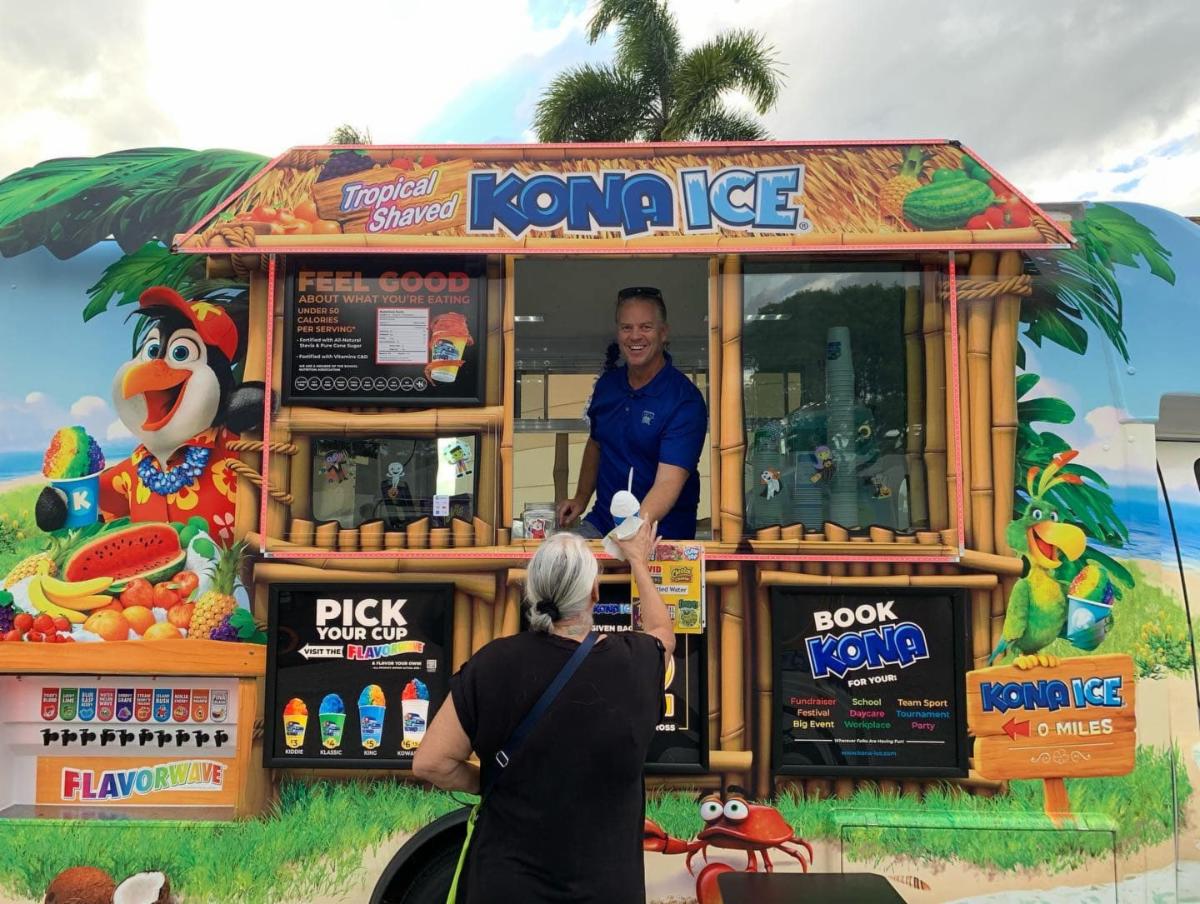 Woman getting food from Food Truck
