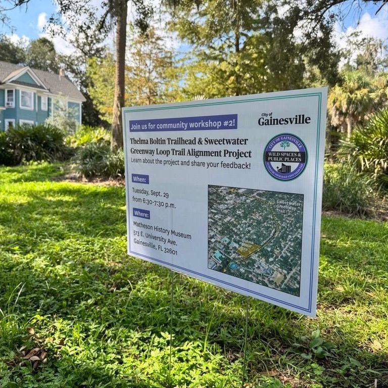 Public-information sign announcing a Gainesville community workshop about the Thelma Boltin Trailhead and Sweetwater Greenway Loop Trail Alignment Project.