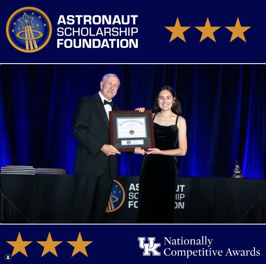 A picture of Jaesylin Stephens accepting a certificate for the Astronaut Scholarship Foundation Award.