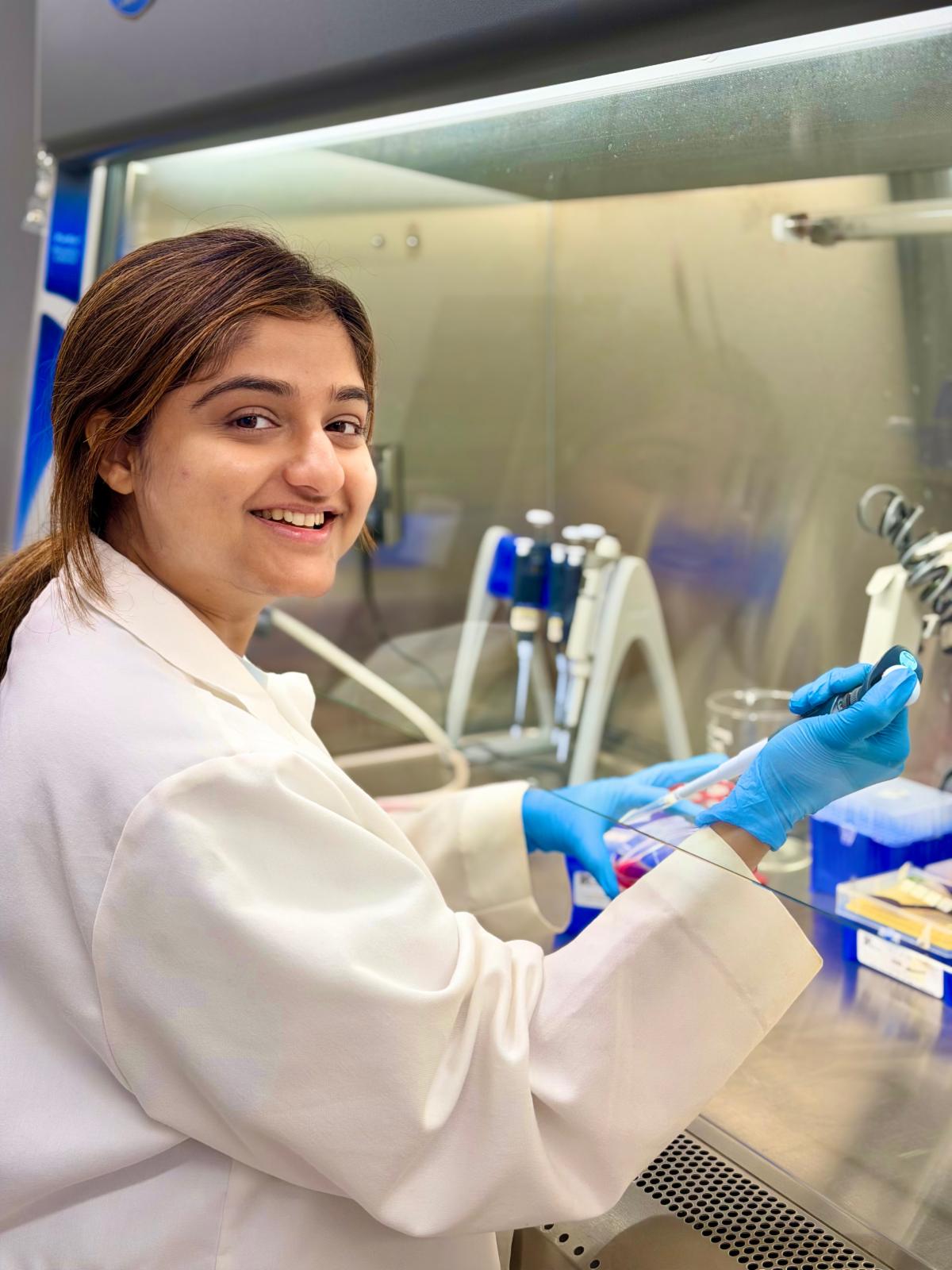 A picture of Sajina Dhungel working in the lab.