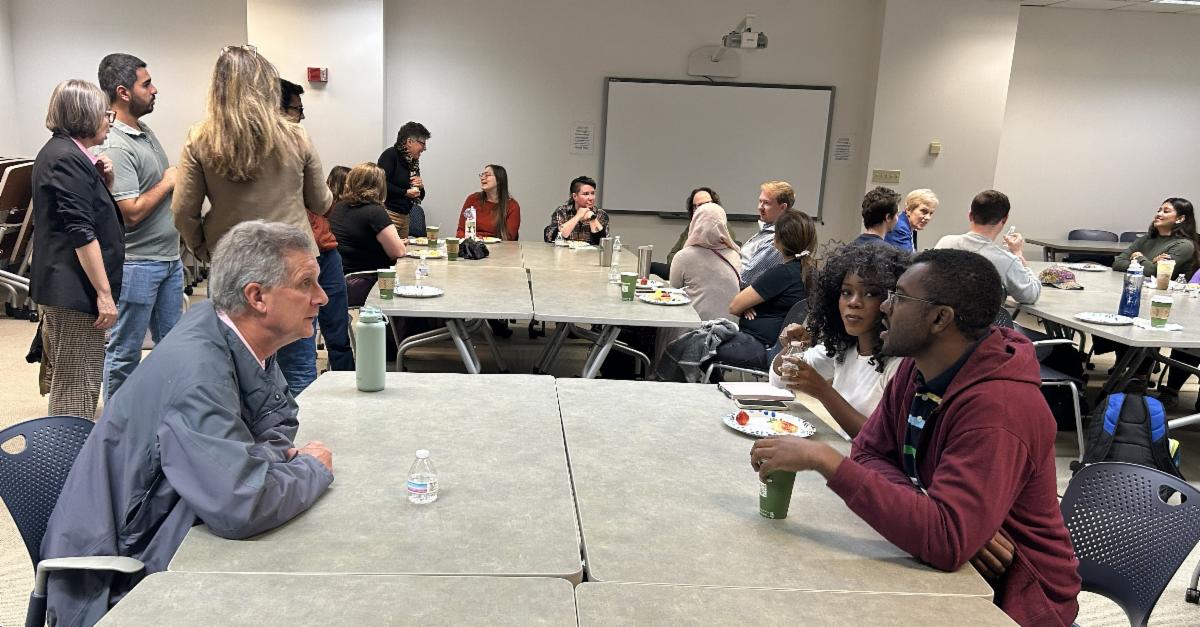 A picture of the Coffee and Networking event with students and alumni.