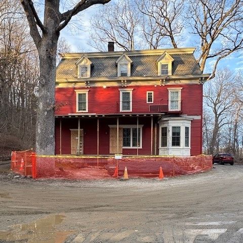 red older three story house renovations starting