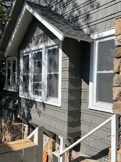 exterior pf grey house exterior being renovated