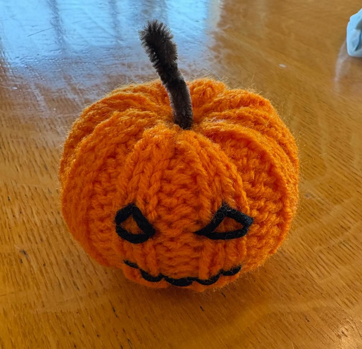 A crochet jack-o-lantern