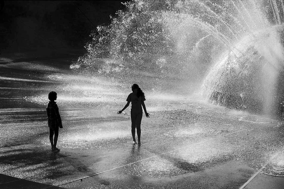 Children playing in a fountain