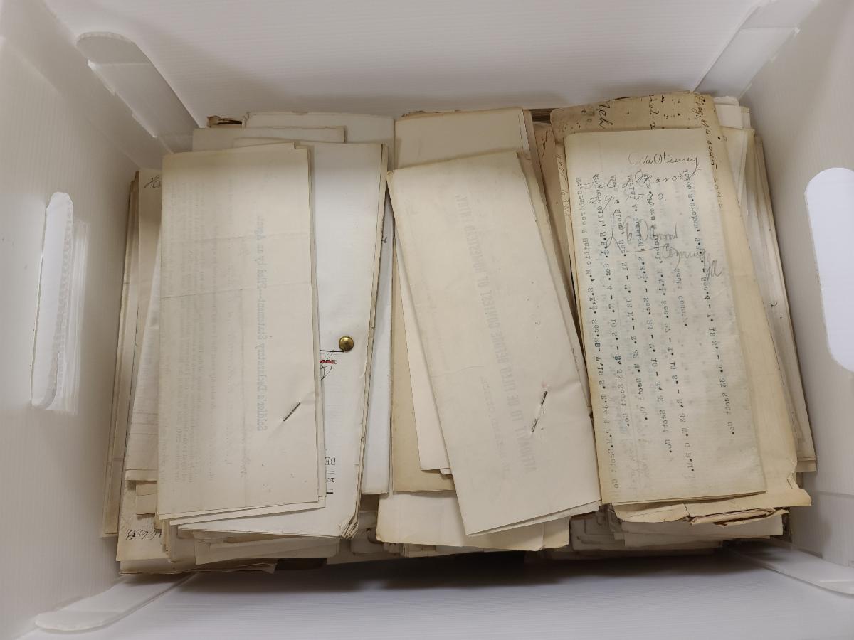 A box full of land records - hundreds of pieces of paper.